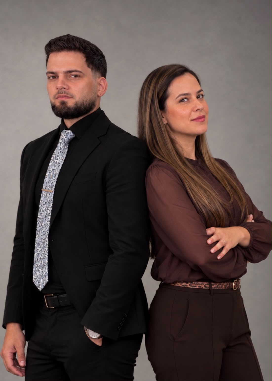 Two NeuroLift team members standing back to back